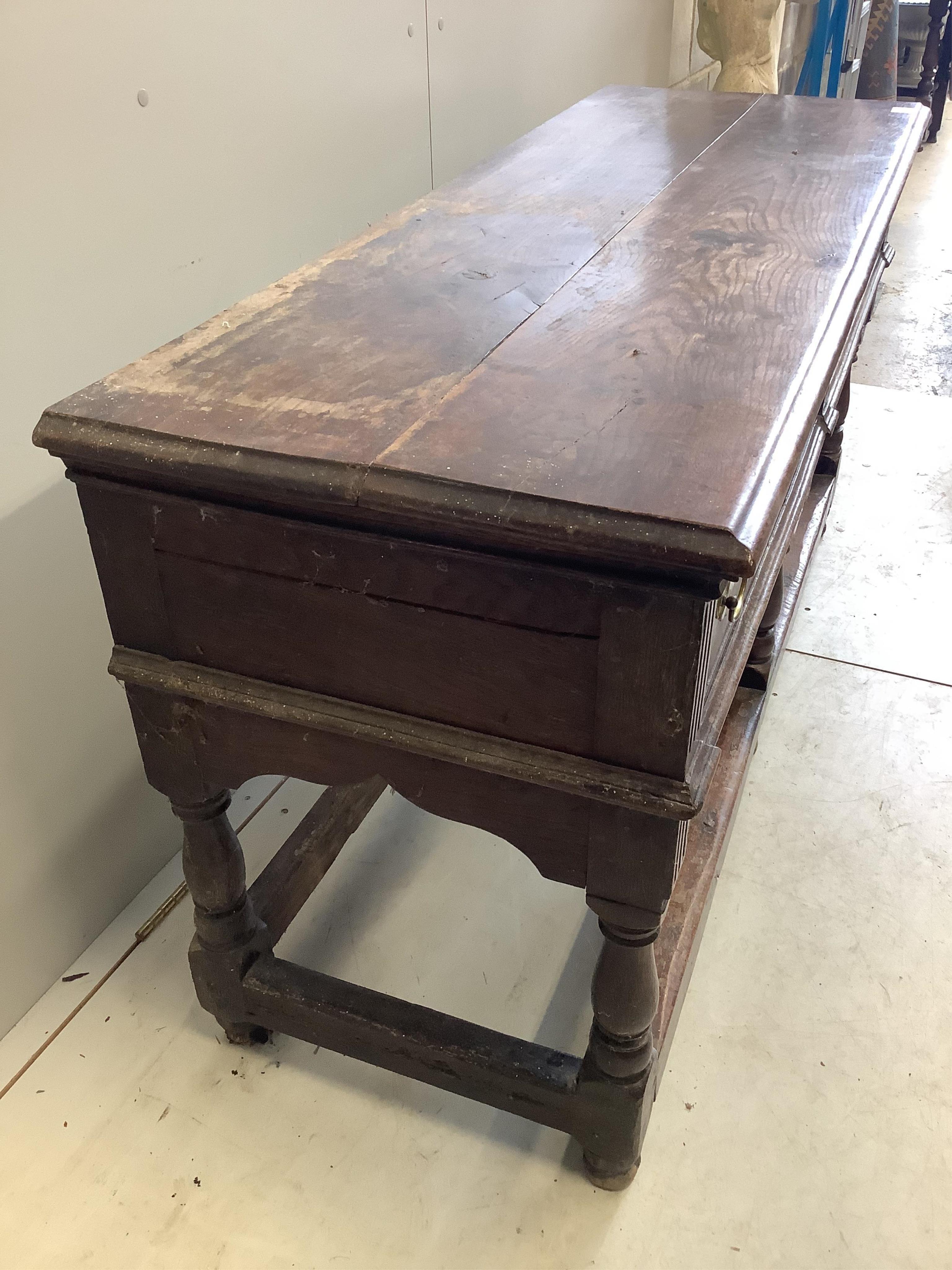 An 18th century oak low dresser base with two long drawers, width 150cm, depth 53cm, height 77cm. Condition - fair